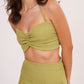 Elegant green halter neck bralette with ruched detailing and tie-up closure, part of a chic co-ord set for confidence and style.