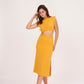 Mustard yellow long skirt with high-waisted design and side slit, made from high-quality muslin fabric. Side cut adds drama and allure. Suitable for dressing up or down.