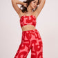 Red Co Ord tube crop top in lightweight cotton satin, featuring pink-red geometric print. Snug yet comfortable fit flatters the figure, perfect for summer days.