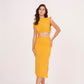 Mustard yellow long skirt with high-waisted design and side slit, made from high-quality muslin fabric. Side cut adds drama and allure. Suitable for dressing up or down.