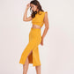 Mustard yellow long skirt with high-waisted design and side slit, made from high-quality muslin fabric. Side cut adds drama and allure. Suitable for dressing up or down.