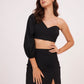 Elegant one-sleeve black top with asymmetrical design, draping across chest and shoulder, made from luxurious muslin fabric